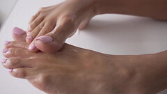 Beautiful brunette gives me a footjob and I cum on her feet - Ashley Sanz Thumb