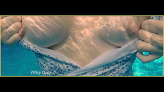 PREVIEW - wife swimming in the hotel pool in a hot one piece Thumb