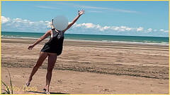 Wife plays football nude at public clothed beach Thumb